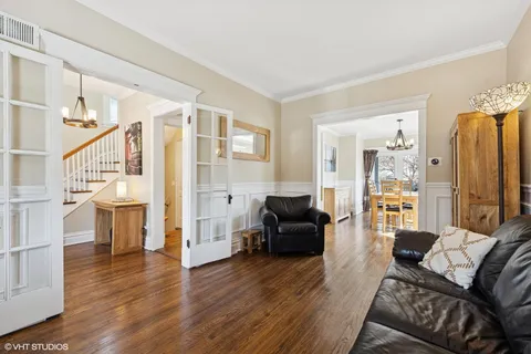 a view of entryway with wooden floor and staircase