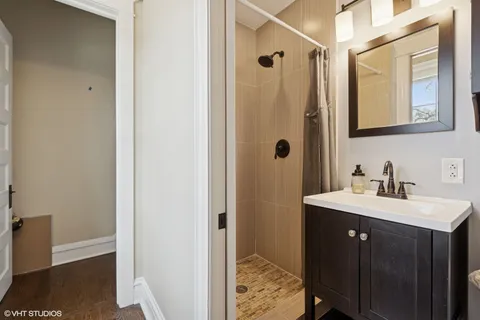 a bathroom with a sink toilet and mirror