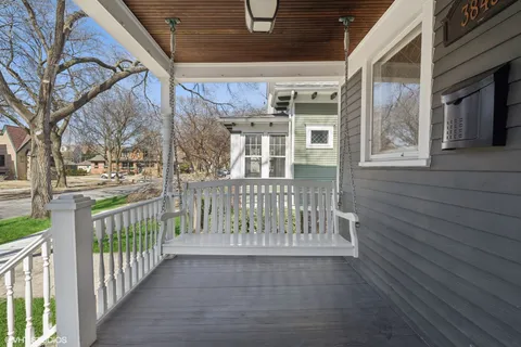 a view of a porch with wooden fence