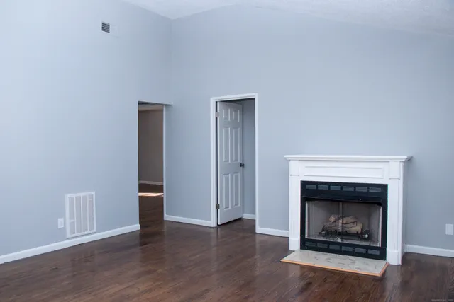 a living room with a fireplace