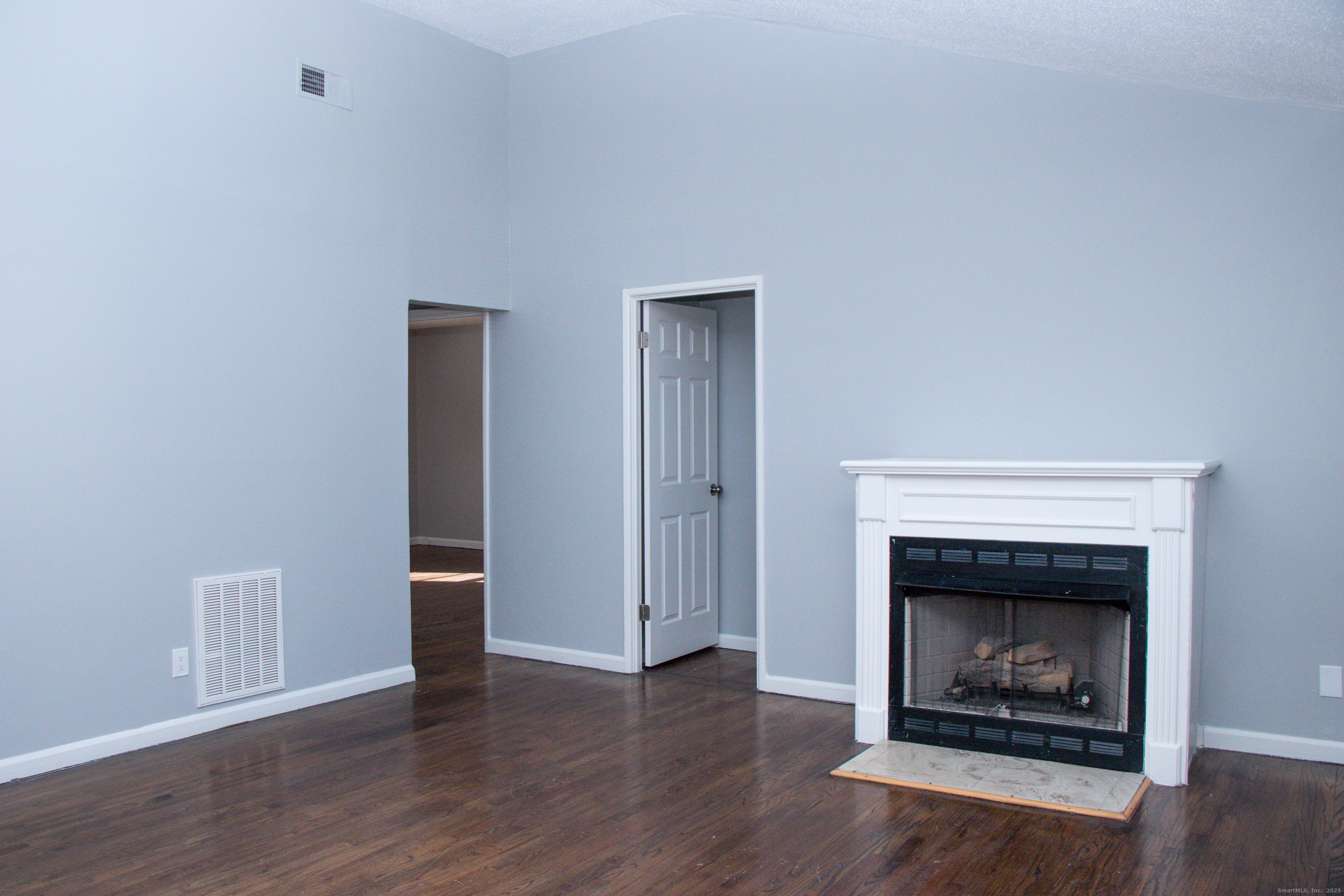 98 Kaye Vue Drive Hamden, CT 06514 - Photo 4 of 7 a living room with a fireplace