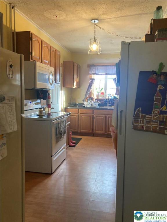 1820 Centre Street Ashland, PA 17921 - Photo 9 of 36 a kitchen with stainless steel appliances granite countertop a stove and a refrigerator