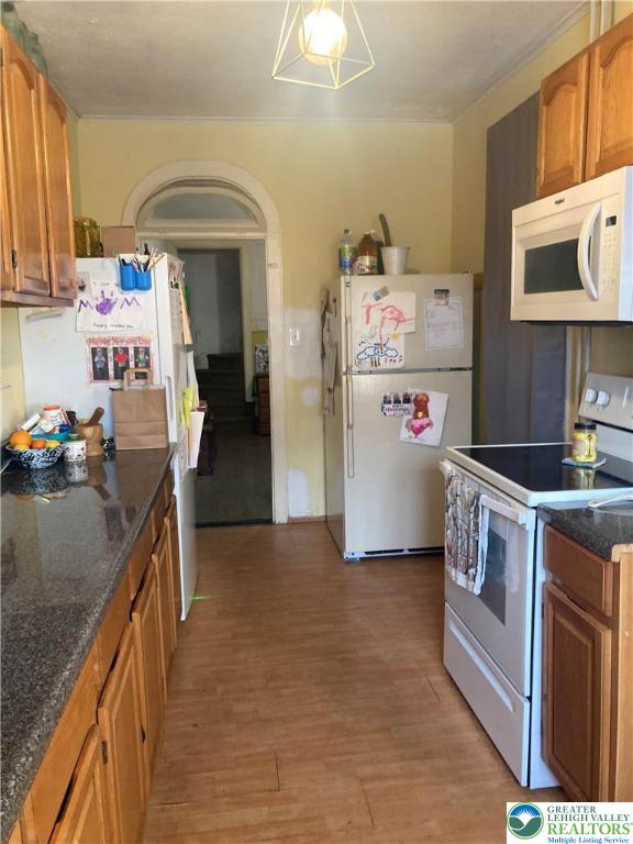 1820 Centre Street Ashland, PA 17921 - Photo 10 of 36 a kitchen with stainless steel appliances granite countertop a refrigerator a stove and a sink