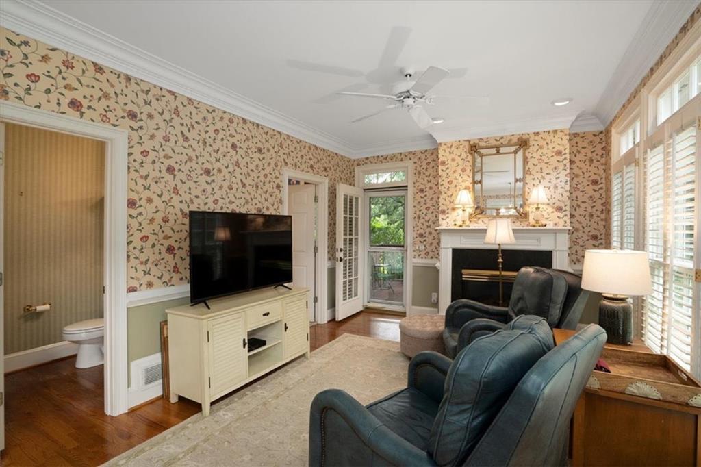 416 McDaniel Street Monroe, GA 30655 - Photo 11 of 69 a living room with furniture and a flat screen tv
