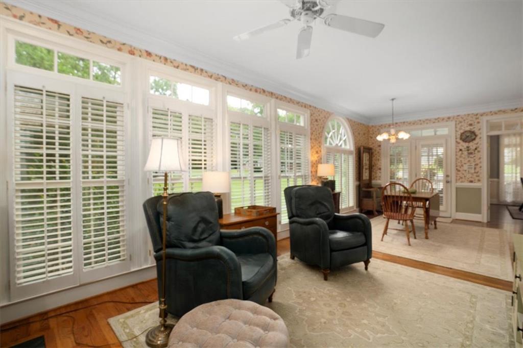 416 McDaniel Street Monroe, GA 30655 - Photo 12 of 69 a living room with furniture and a large window