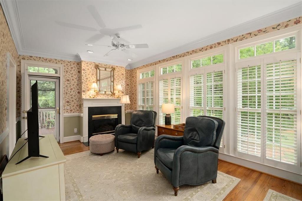 416 McDaniel Street Monroe, GA 30655 - Photo 15 of 69 a living room with furniture and a fireplace