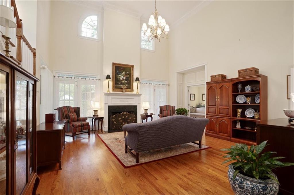 416 McDaniel Street Monroe, GA 30655 - Photo 18 of 69 a living room with furniture and a fireplace