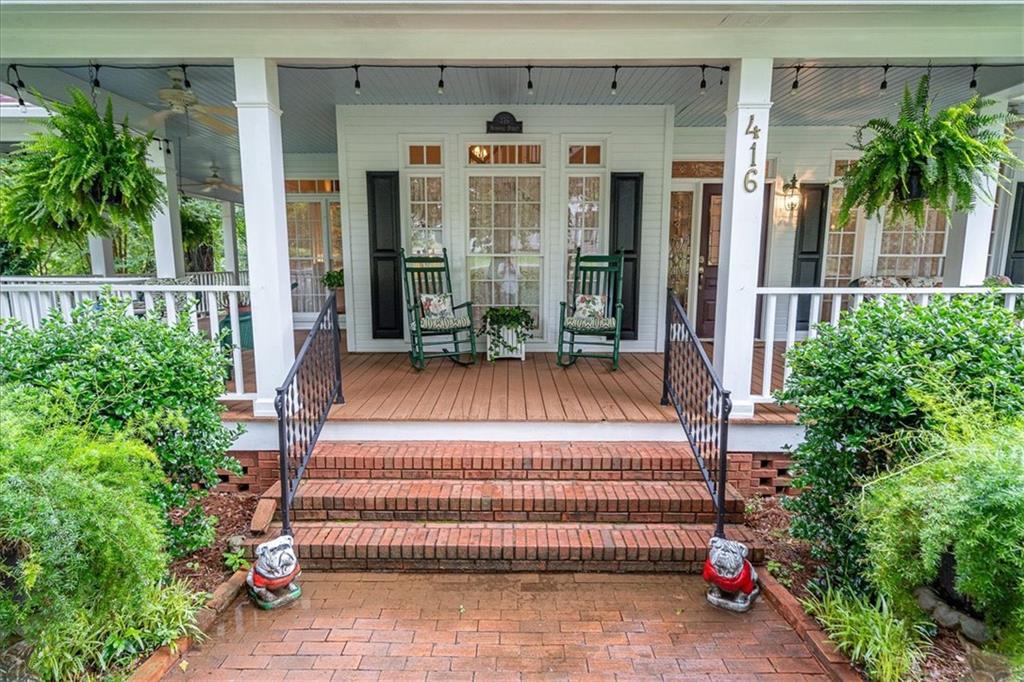 416 McDaniel Street Monroe, GA 30655 - Photo 2 of 69 a front view of a house with a garden