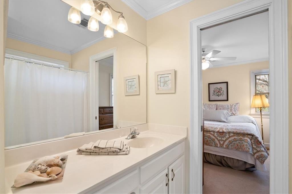 416 McDaniel Street Monroe, GA 30655 - Photo 24 of 69 a en suite bathroom with a double vanity and a mirror