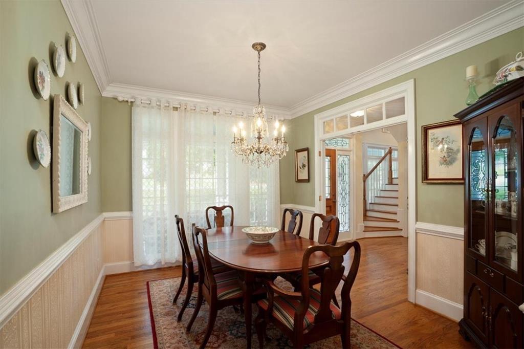 416 McDaniel Street Monroe, GA 30655 - Photo 4 of 69 a view of a dining room with furniture window and wooden floor