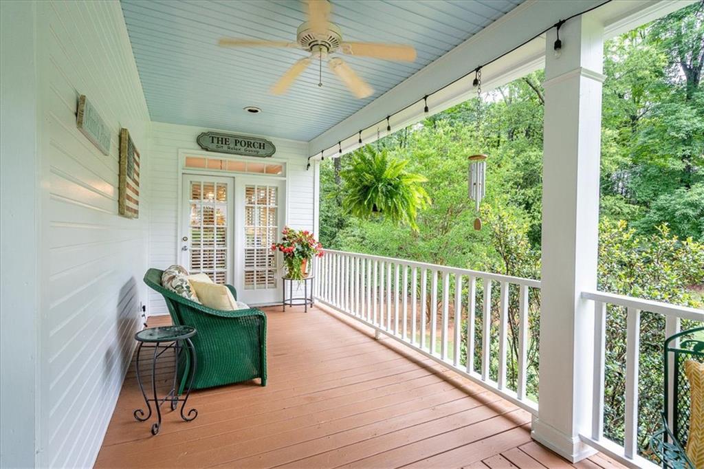 416 McDaniel Street Monroe, GA 30655 - Photo 47 of 69 a view of a porch with furniture and a yard