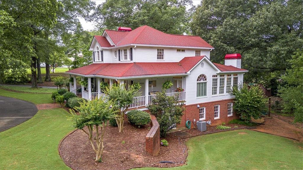 416 McDaniel Street Monroe, GA 30655 - Photo 57 of 69 a view of a house with a yard porch and sitting area