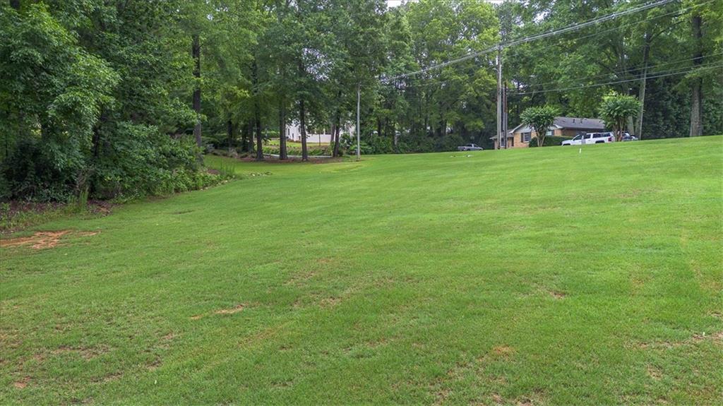 416 McDaniel Street Monroe, GA 30655 - Photo 67 of 69 a view of a park with trees and grass