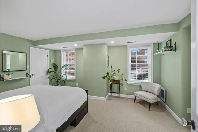 a bedroom with a balcony a bed and a couch