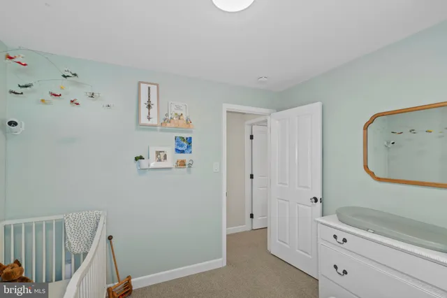 a spacious bathroom with a double vanity sink and a mirror