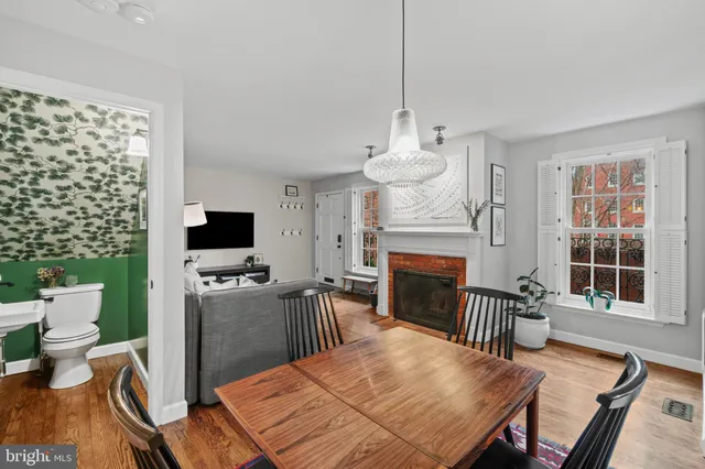 a view of a livingroom with furniture window and wooden floor