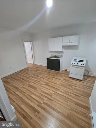 a room with a bed and cabinets
