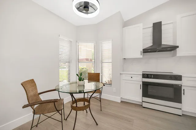 a view of a dining room with furniture and a fireplace