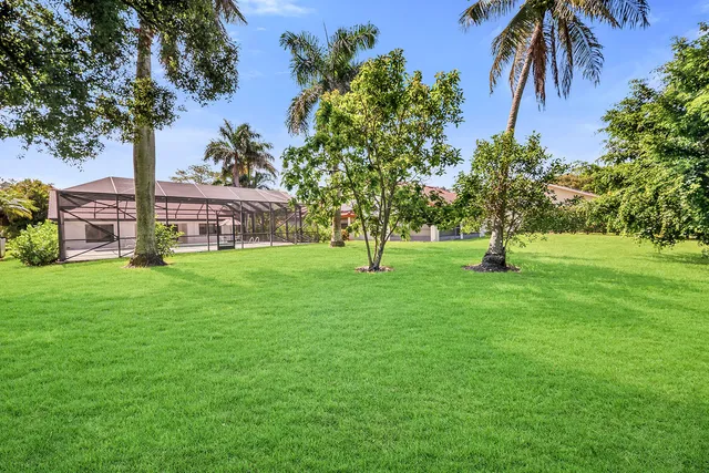 an aerial view of residential houses with outdoor space and street view