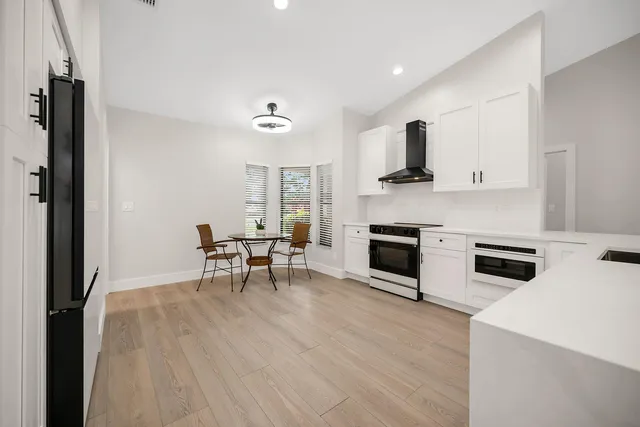 a living room with furniture and fireplace