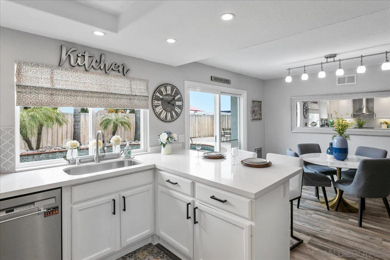 13663 Paseo Del Mar El Cajon, CA 92021 - Photo 11 of 36 a kitchen with a sink cabinets and window