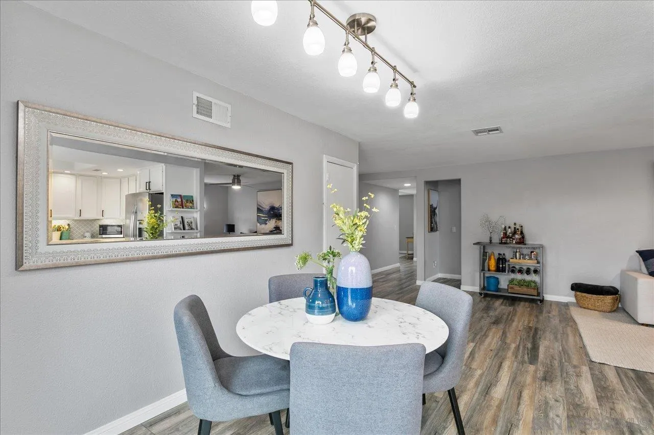 13663 Paseo Del Mar El Cajon, CA 92021 - Photo 13 of 36 a dining room with furniture and wooden floor