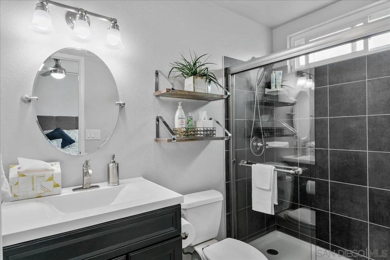 13663 Paseo Del Mar El Cajon, CA 92021 - Photo 16 of 36 a bathroom with a sink a toilet and shower