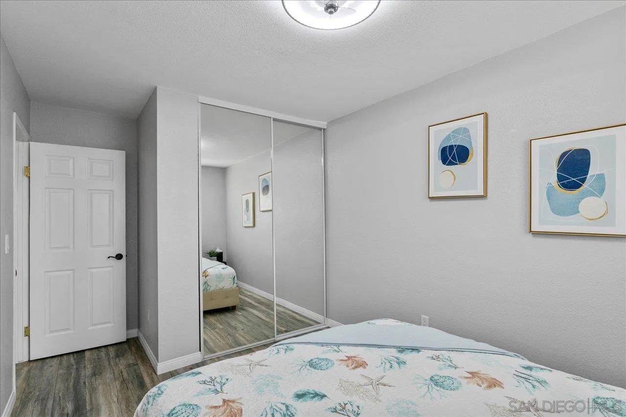 13663 Paseo Del Mar El Cajon, CA 92021 - Photo 17 of 36 a bedroom with a bed and wooden floor