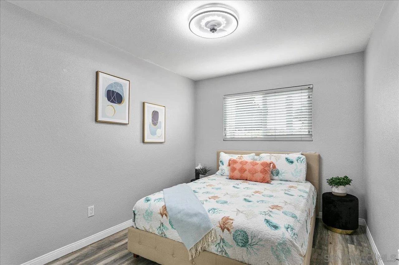13663 Paseo Del Mar El Cajon, CA 92021 - Photo 18 of 36 a bedroom with a bed and a window
