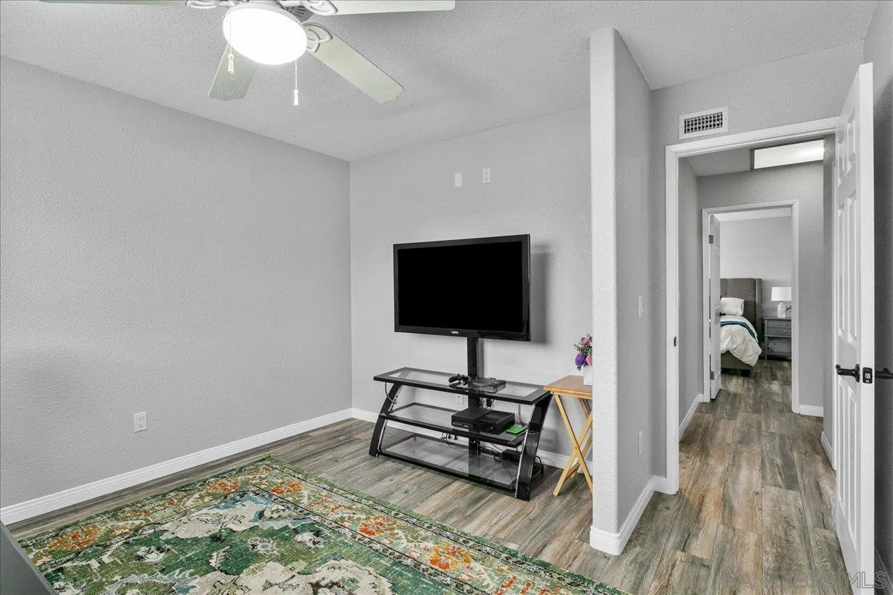 13663 Paseo Del Mar El Cajon, CA 92021 - Photo 20 of 36 a living room with furniture and a flat screen tv