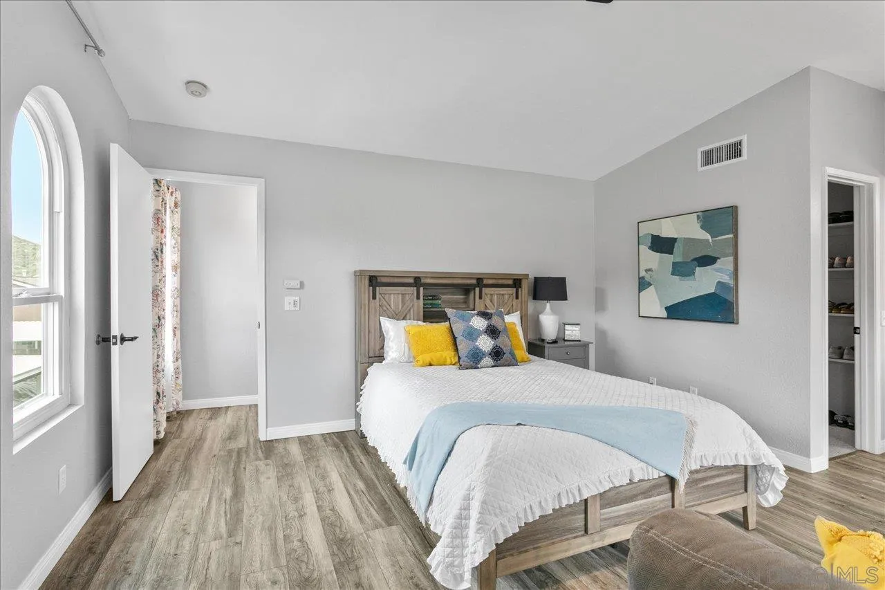 13663 Paseo Del Mar El Cajon, CA 92021 - Photo 22 of 36 a bedroom with a bed and a table