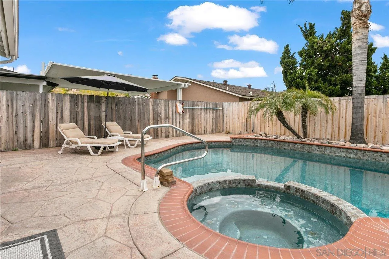 13663 Paseo Del Mar El Cajon, CA 92021 - Photo 30 of 36 a view of a swimming pool with chair and tables