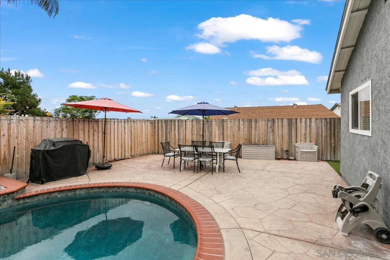 13663 Paseo Del Mar El Cajon, CA 92021 - Photo 31 of 36 a view of outdoor sitting area with furniture and umbrella