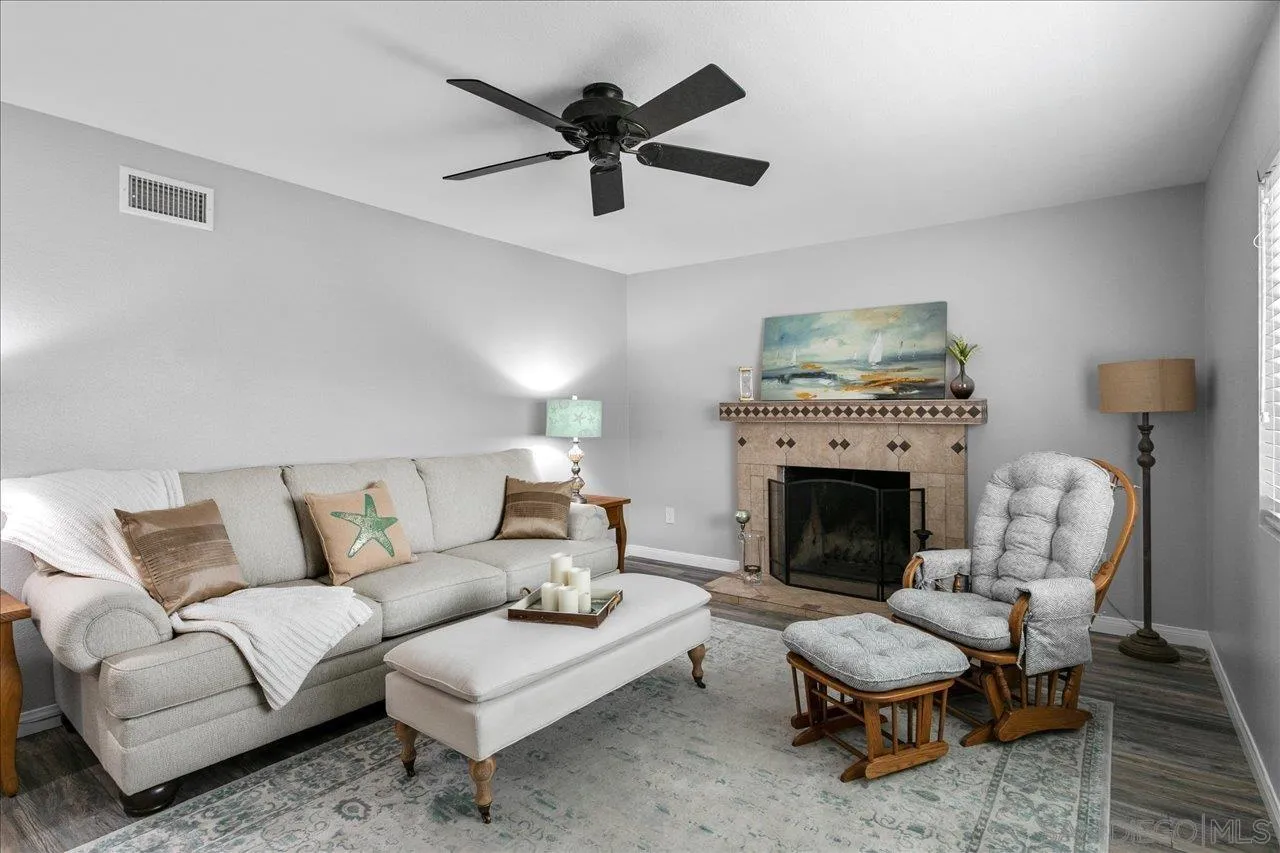 13663 Paseo Del Mar El Cajon, CA 92021 - Photo 5 of 36 a living room with furniture and a fireplace