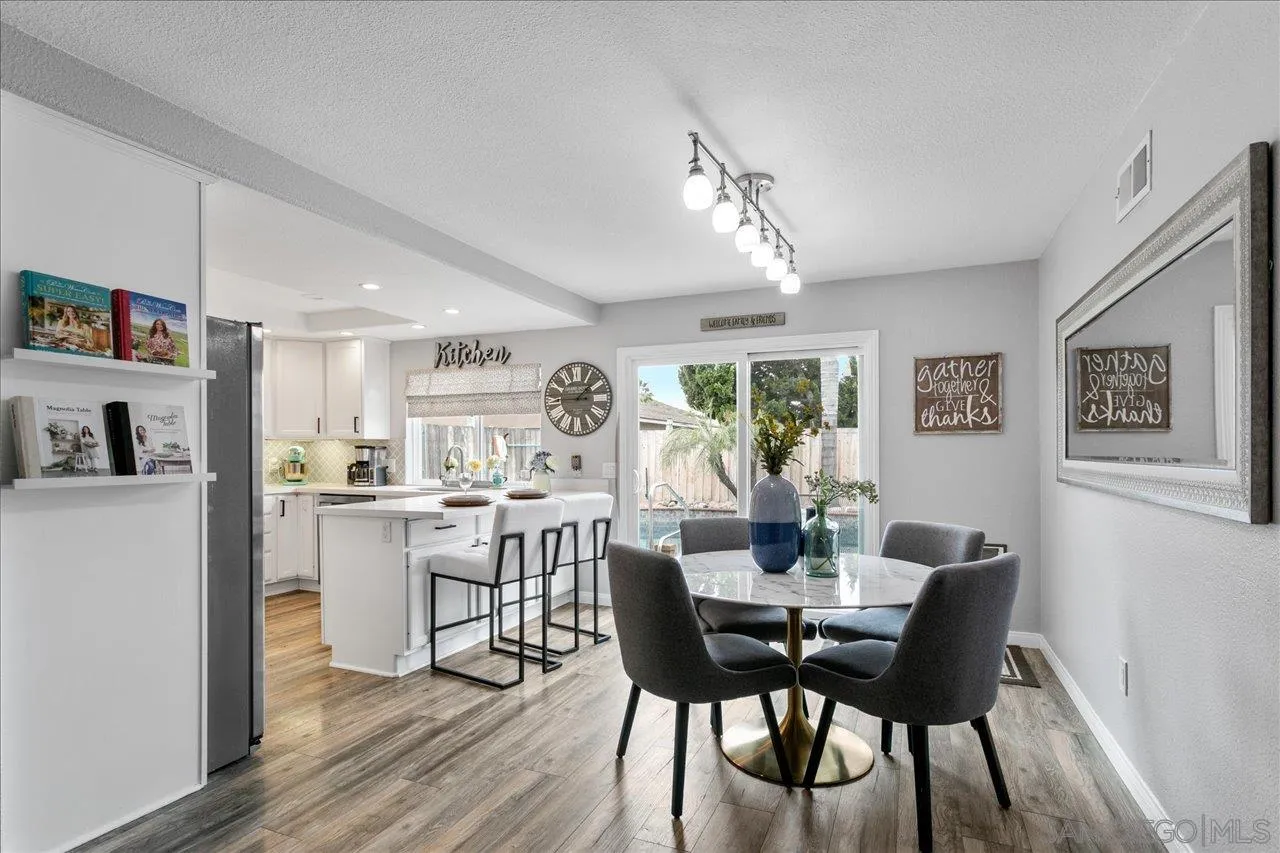 13663 Paseo Del Mar El Cajon, CA 92021 - Photo 7 of 36 a view of a dining room with furniture window and wooden floor
