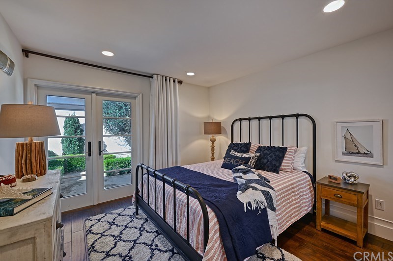 33701 Windjammer Drive Dana Point, CA 92629 - Photo 22 of 35 a bedroom with a bed a lamp and window