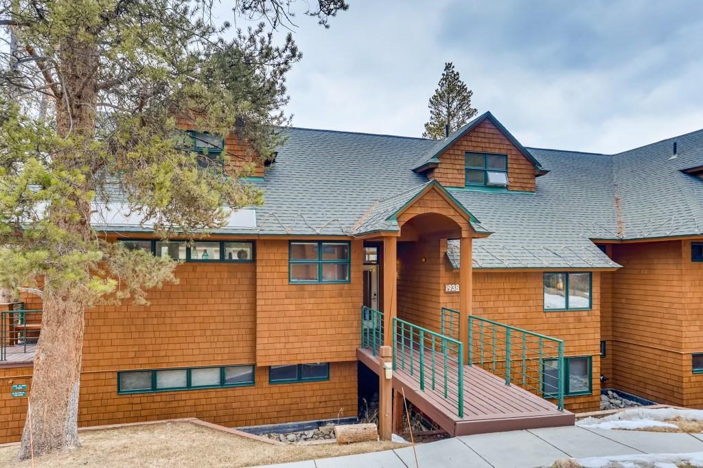 2017 Soda Ridge Road, Unit 1938 Keystone, CO 80435 - Photo 1 of 31 a front view of a house with yard