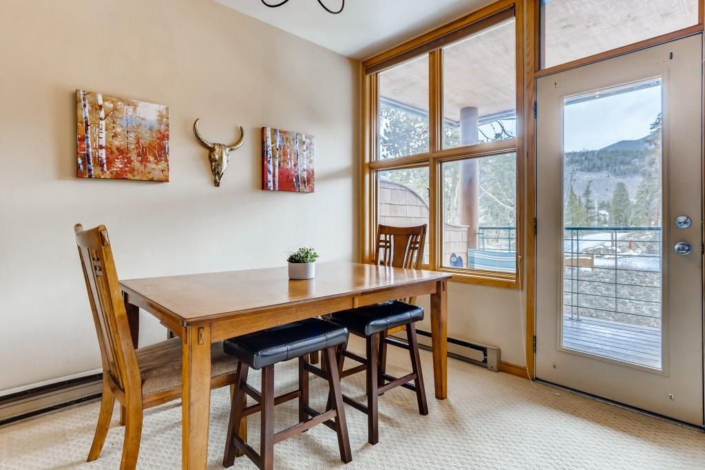 2017 Soda Ridge Road, Unit 1938 Keystone, CO 80435 - Photo 12 of 31 a view of a dining room with furniture large window and outside view
