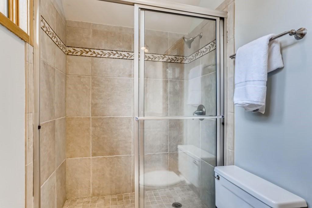 2017 Soda Ridge Road, Unit 1938 Keystone, CO 80435 - Photo 15 of 31 a bathroom with a glass shower door