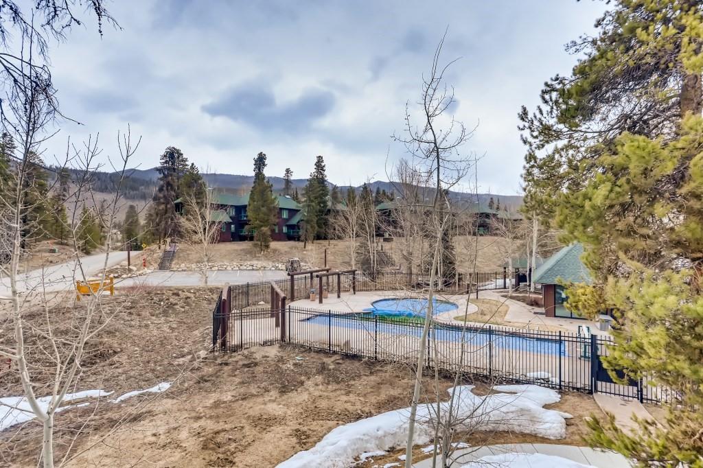 2017 Soda Ridge Road, Unit 1938 Keystone, CO 80435 - Photo 28 of 31 a view of a yard with a table and chairs