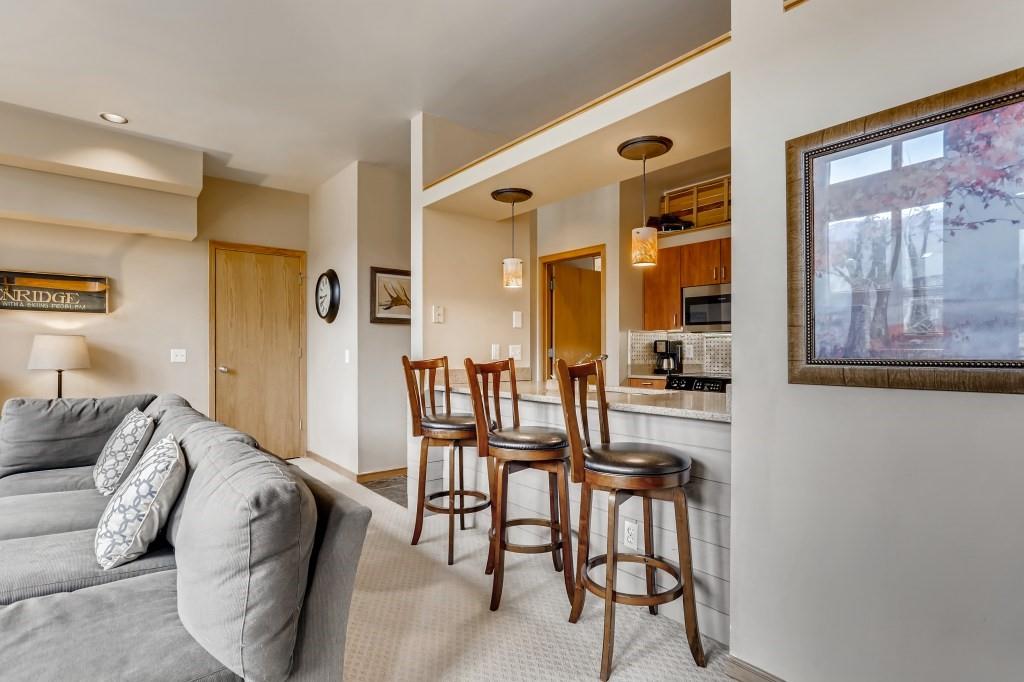 2017 Soda Ridge Road, Unit 1938 Keystone, CO 80435 - Photo 7 of 31 a living room with furniture and a table