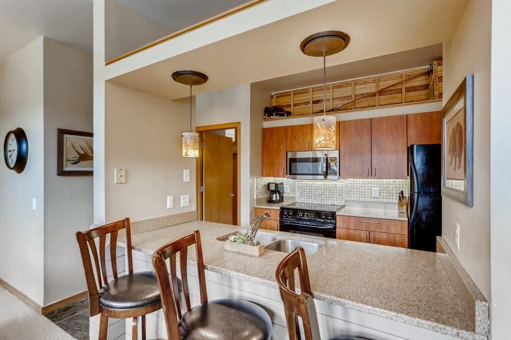2017 Soda Ridge Road, Unit 1938 Keystone, CO 80435 - Photo 8 of 31 a living room with furniture and a fireplace