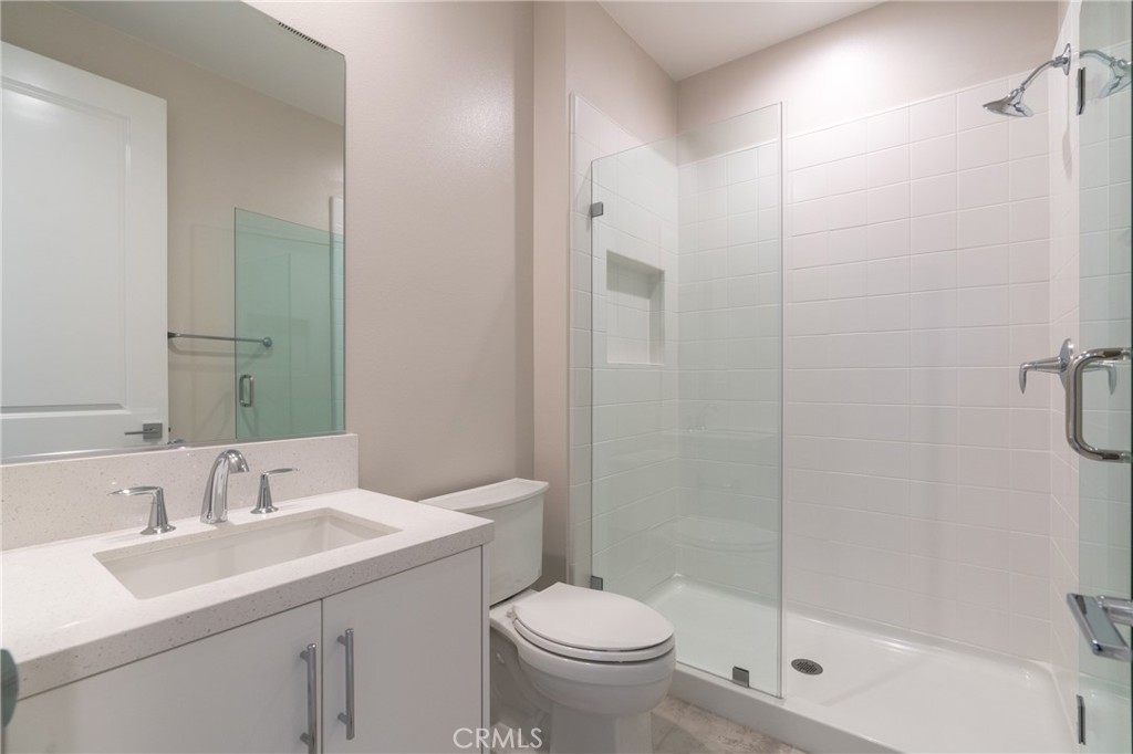 210 Pin Lane Lake Forest, CA 92630 - Photo 19 of 22 a bathroom with a sink toilet and shower