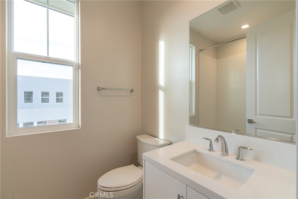 210 Pin Lane Lake Forest, CA 92630 - Photo 8 of 22 a bathroom with a sink toilet and vanity