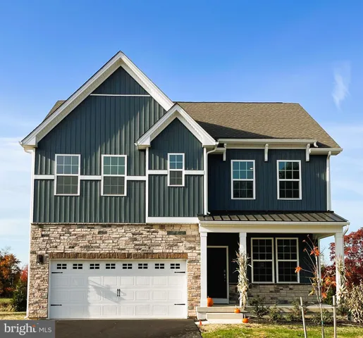 a front view of a house with glass windows