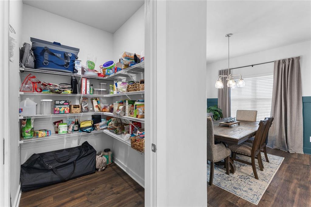 2253 Cotton Gin Row Jefferson, GA 30549 - Photo 13 of 45 a workspace with furniture and a book shelf