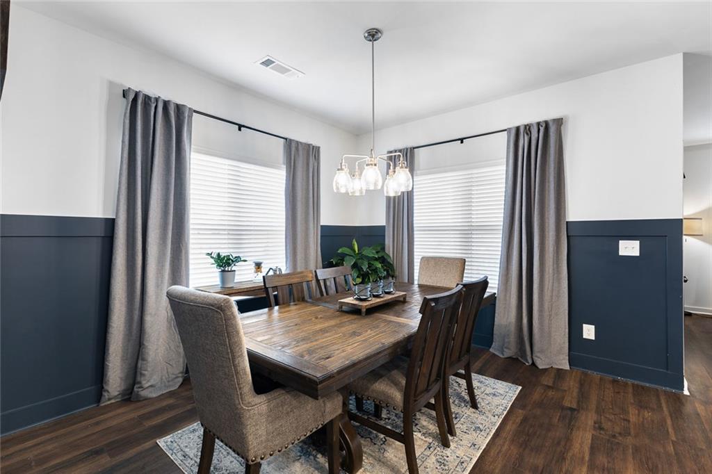 2253 Cotton Gin Row Jefferson, GA 30549 - Photo 14 of 45 a view of a dining room with furniture window and wooden floor
