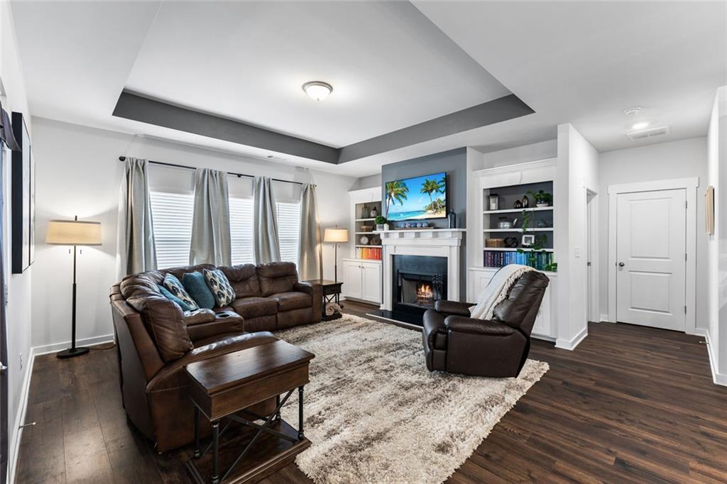 2253 Cotton Gin Row Jefferson, GA 30549 - Photo 15 of 45 a living room with furniture and a fireplace