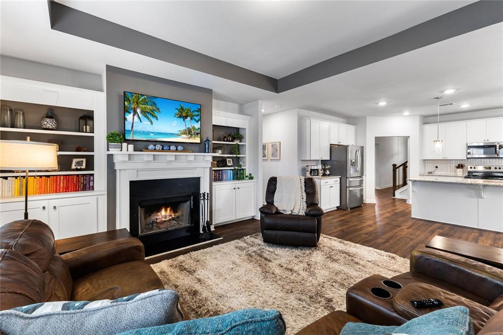 2253 Cotton Gin Row Jefferson, GA 30549 - Photo 16 of 45 a living room with furniture and a fireplace