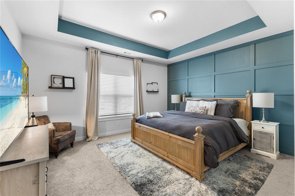 2253 Cotton Gin Row Jefferson, GA 30549 - Photo 18 of 45 a bedroom with a bed and furniture